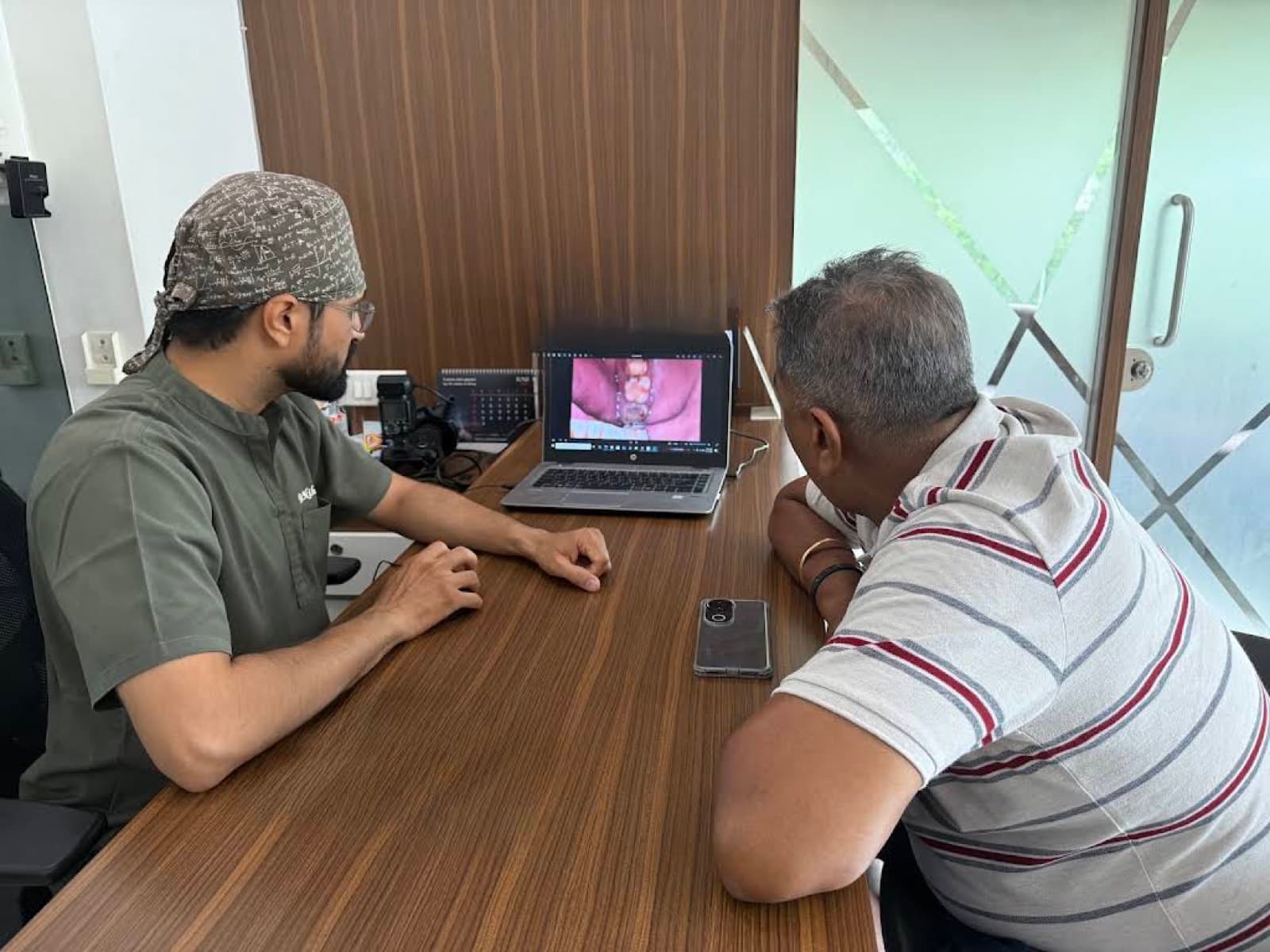 Dr. Nihar reviewing a diagnosis with a patient