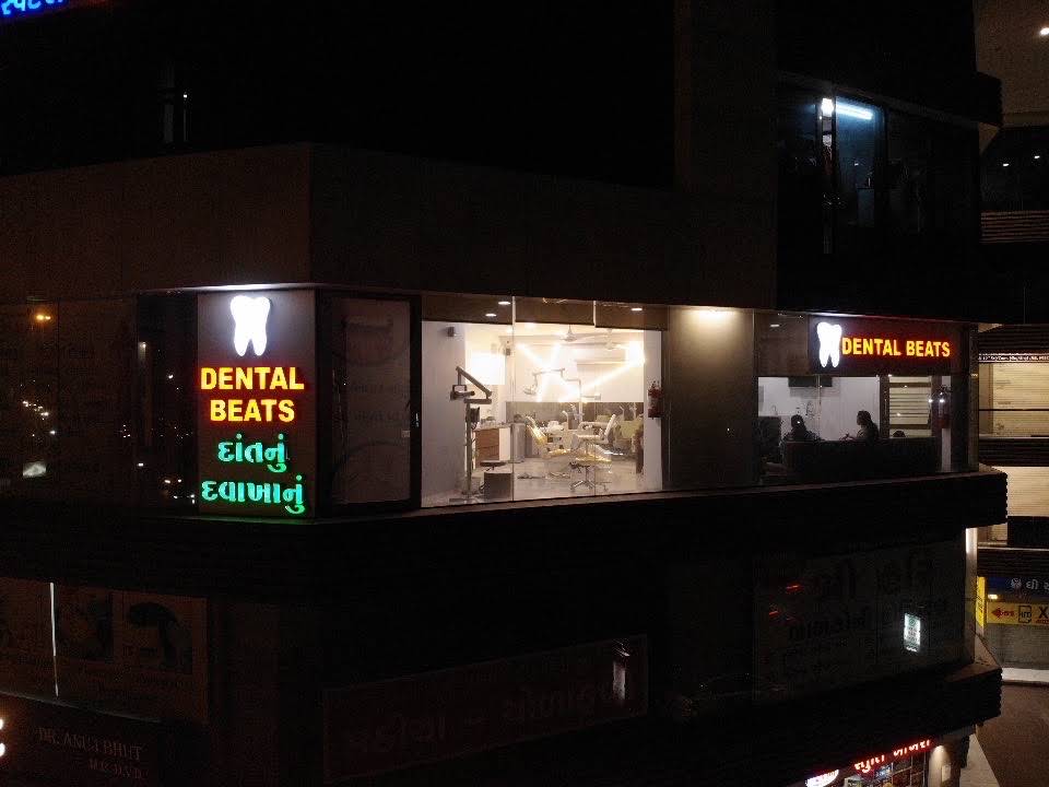 Dental Beats storefront lit up at night